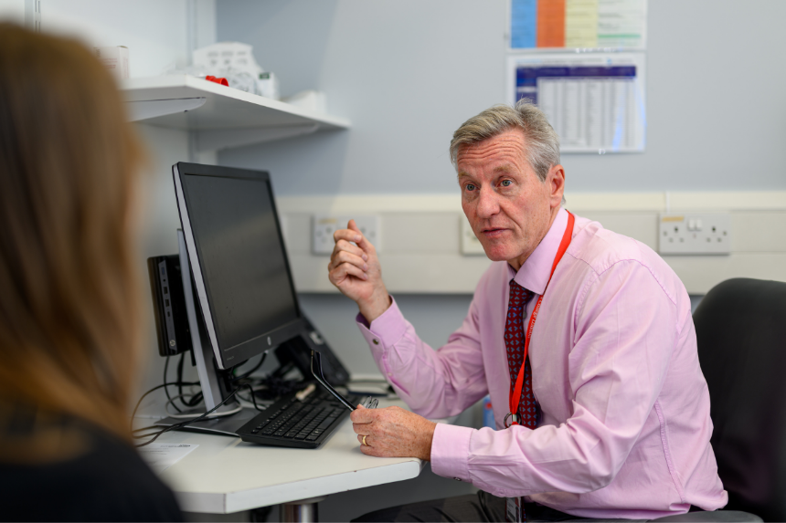 Male clinician talking to a patient