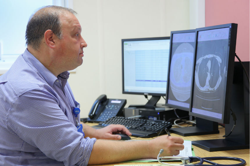 Chronic lung infection male at computer screen